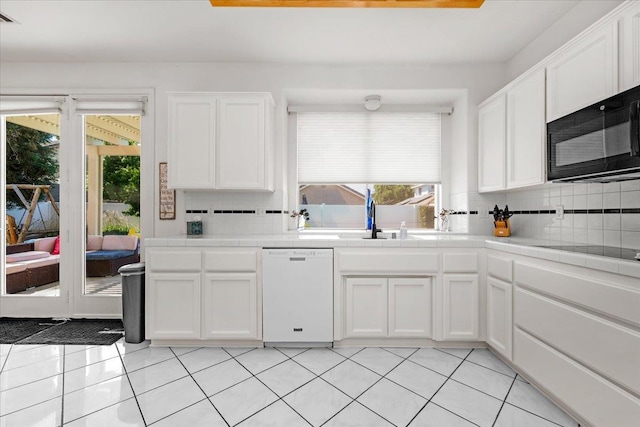 2162 Decatur Ave, Clovis, CA 93611 - kitchen featuring black appliances, tile counters, a sink, and backsplash