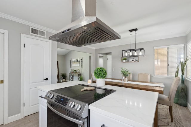 1583 San Gabriel Ave, Clovis, CA 93611 - kitchen featuring exhaust hood, stainless steel electric range, light wood finished floors, ornamental molding, and baseboards