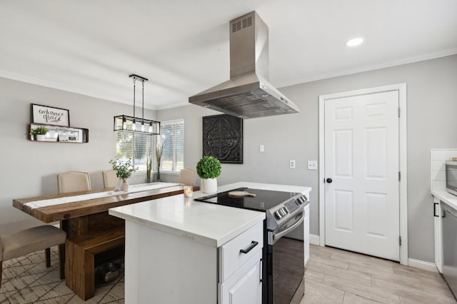 1583 San Gabriel Ave, Clovis, CA 93611 - kitchen with electric range, island exhaust hood, light countertops, ornamental molding, and a center island