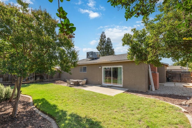 1583 San Gabriel Ave, Clovis, CA 93611 - back of property featuring stucco siding, a patio area, and central AC