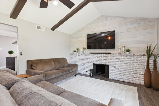 1583 San Gabriel Ave, Clovis, CA 93611 - living room featuring wood finished floors, a fireplace, ceiling fan, wooden walls, and baseboards