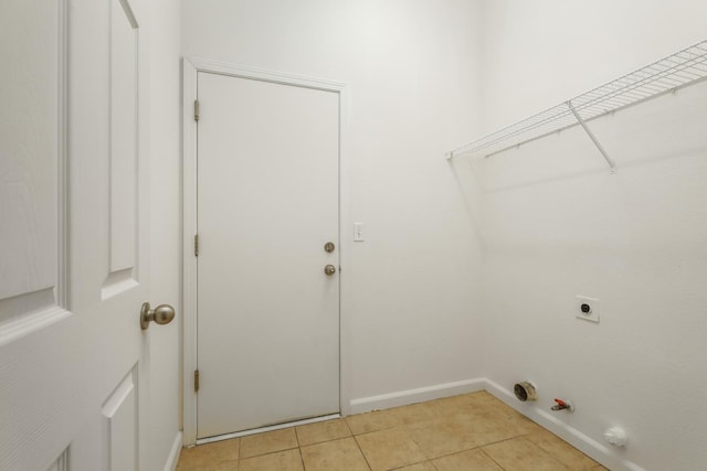 6674 E Alta Ave, Fresno, CA 93727 - laundry room with gas dryer hookup, light tile patterned flooring, hookup for an electric dryer, and baseboards