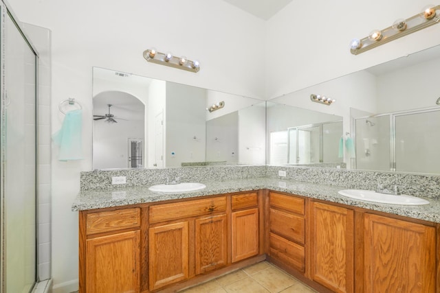6674 E Alta Ave, Fresno, CA 93727 - bathroom with a stall shower, a ceiling fan, and double vanity