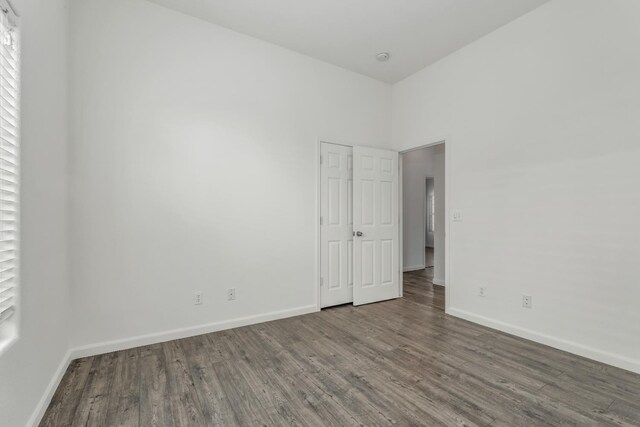 6674 E Alta Ave, Fresno, CA 93727 - empty room with wood finished floors and baseboards