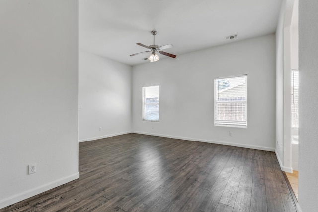 6674 E Alta Ave, Fresno, CA 93727 - spare room featuring healthy amount of natural light, ceiling fan, and dark wood-type flooring