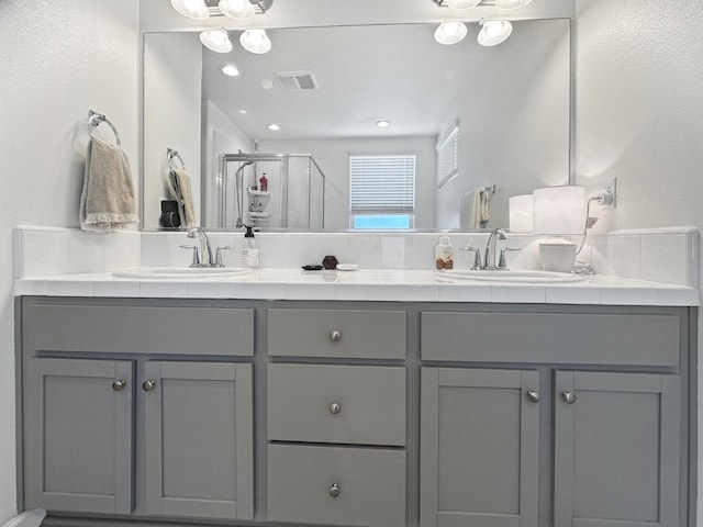 922 Winchell Way W, Madera, CA 93636 - bathroom with a shower stall and double vanity