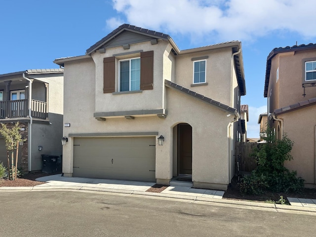 922 Winchell Way W, Madera, CA 93636 - view of front of home featuring stucco siding, a garage, and a tiled roof