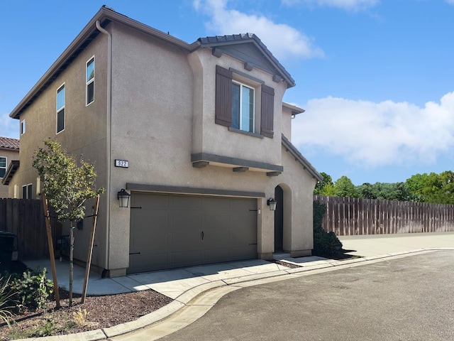 922 Winchell Way W, Madera, CA 93636 - view of front of property featuring stucco siding and a garage