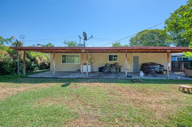 1431 N Willow Ave, Fresno, CA 93727 - rear view of property featuring a patio, stucco siding, and a yard