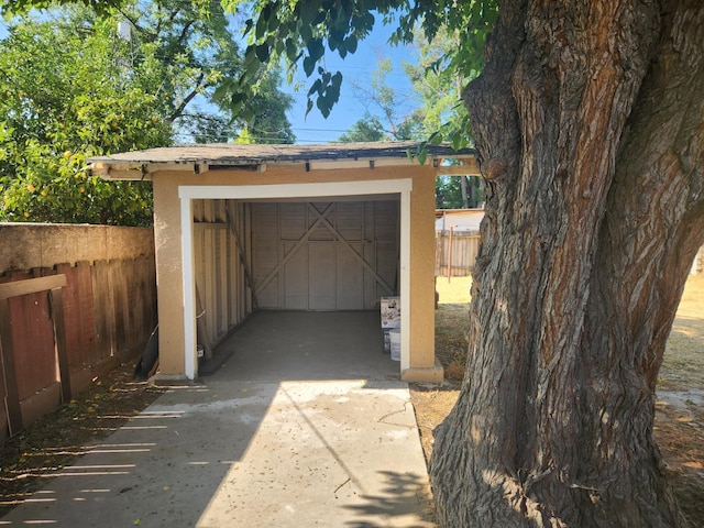 1132 E Fountain Way, Fresno, CA 93704 - detached garage featuring driveway and a storage shed