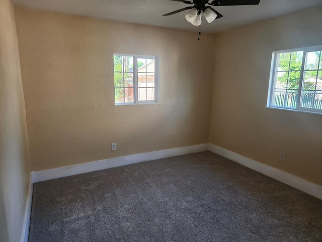 1132 E Fountain Way, Fresno, CA 93704 - empty room with healthy amount of natural light, a ceiling fan, carpet flooring, and baseboards