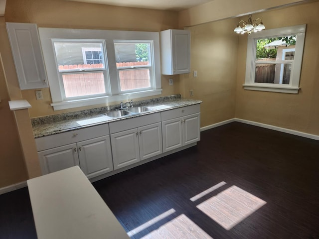1132 E Fountain Way, Fresno, CA 93704 - kitchen featuring a sink, dark wood-style flooring, a chandelier, and light countertops