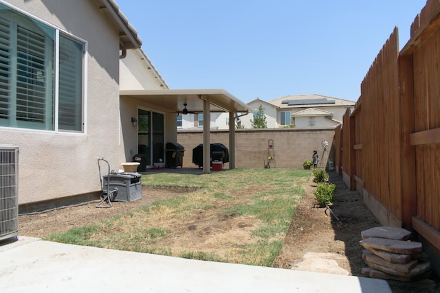 6379 W Northdale Ave, Fresno, CA 93723 - fenced backyard featuring a ceiling fan, central air condition unit, and a patio area