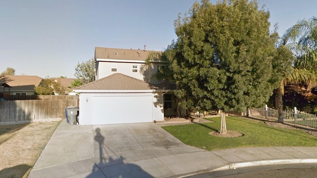 863 Goosecross Dr, Madera, CA 93637 - obstructed view of property featuring driveway, a garage, and stucco siding