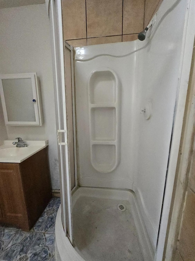 924 W Myers, Fresno, CA 93706 - bathroom featuring vanity, a stall shower, and tile patterned flooring