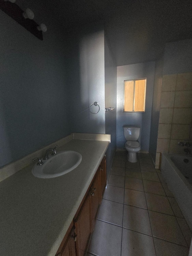 924 W Myers, Fresno, CA 93706 - full bath featuring tile patterned floors, toilet, vanity, a bathtub, and baseboards