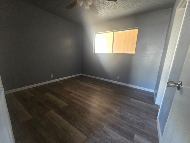 924 W Myers, Fresno, CA 93706 - spare room with ceiling fan, dark wood-style floors, a textured ceiling, and baseboards