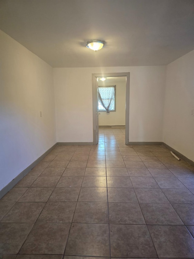 924 W Myers, Fresno, CA 93706 - empty room with tile patterned floors and baseboards