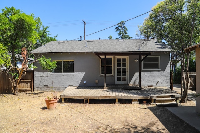 1020 E Saginaw Way, Fresno, CA 93704 - back of house featuring stucco siding, a wooden deck, and roof with shingles