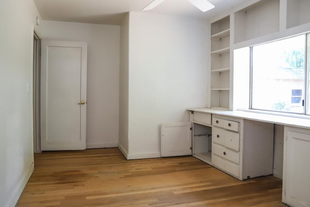 1020 E Saginaw Way, Fresno, CA 93704 - unfurnished office featuring light wood-style flooring, ceiling fan, and built in study area