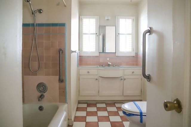 1020 E Saginaw Way, Fresno, CA 93704 - bathroom with vanity,  shower combination, tile patterned floors, and backsplash