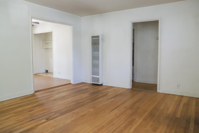 1020 E Saginaw Way, Fresno, CA 93704 - spare room with a heating unit and light wood-style floors