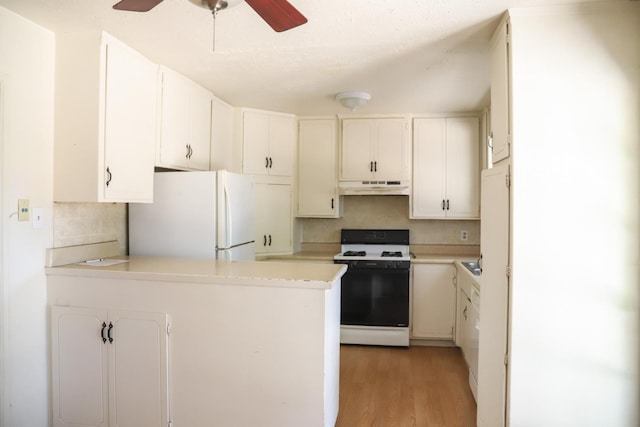 1020 E Saginaw Way, Fresno, CA 93704 - kitchen featuring white appliances, under cabinet range hood, a peninsula, ceiling fan, and light countertops