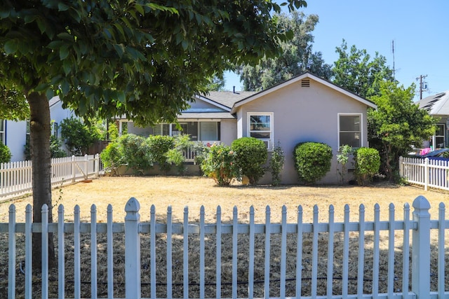 1020 E Saginaw Way, Fresno, CA 93704 - view of front of house featuring stucco siding and a fenced backyard