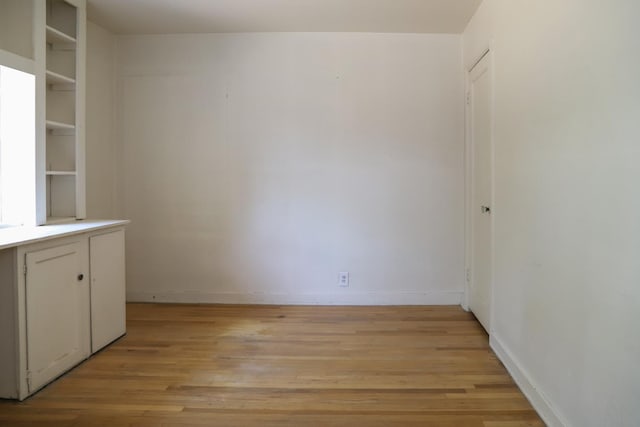 1020 E Saginaw Way, Fresno, CA 93704 - unfurnished dining area with light wood finished floors and baseboards