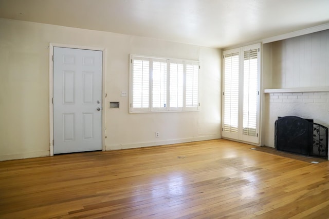 1020 E Saginaw Way, Fresno, CA 93704 - unfurnished living room featuring light wood-type flooring and a fireplace