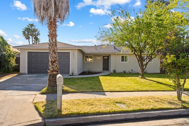 3877 N Ezie, Fresno, CA 93727 - single story home featuring an attached garage, driveway, and a front yard