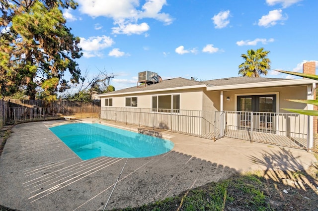 3877 N Ezie, Fresno, CA 93727 - view of swimming pool with a patio, french doors, and a fenced backyard