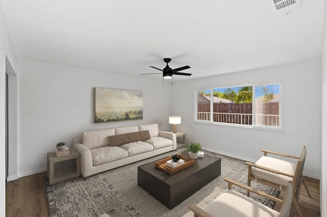 3877 N Ezie, Fresno, CA 93727 - living room featuring ceiling fan, baseboards, and wood finished floors