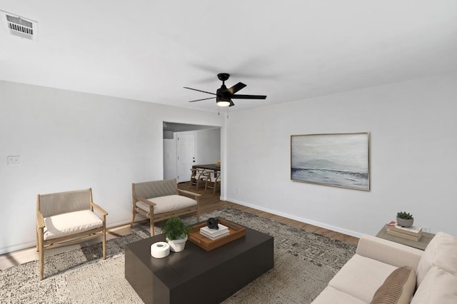 3877 N Ezie, Fresno, CA 93727 - living room featuring wood finished floors, ceiling fan, and baseboards