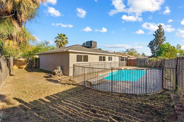 3877 N Ezie, Fresno, CA 93727 - view of pool with a fenced backyard, central air condition unit, and a patio