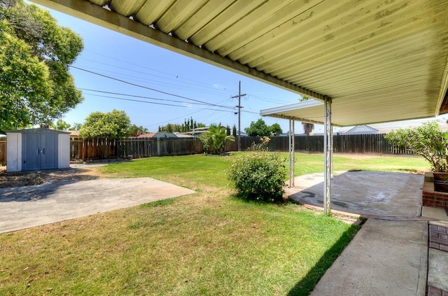 127 E Escalon Ave, Fresno, CA 93710 - fenced backyard with a patio and a storage unit