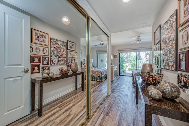 6772 N Wembley Dr, Fresno, CA 93711 - hallway with light wood-style floors, baseboards, and recessed lighting