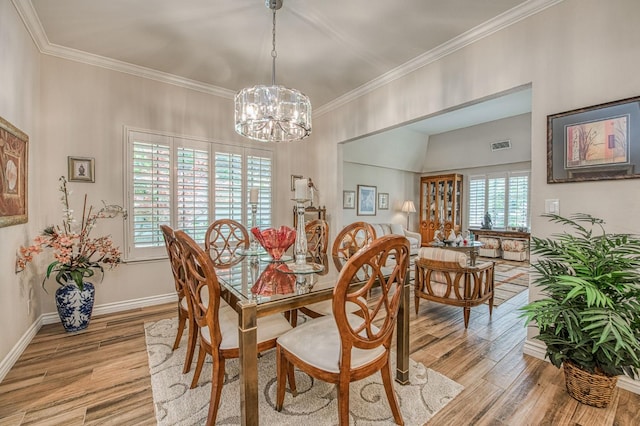 6772 N Wembley Dr, Fresno, CA 93711 - dining room with light wood-style floors, ornamental molding, a chandelier, and baseboards