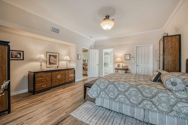 6772 N Wembley Dr, Fresno, CA 93711 - bedroom featuring ornamental molding, wood finished floors, baseboards, and connected bathroom