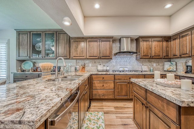 6772 N Wembley Dr, Fresno, CA 93711 - kitchen featuring wall chimney exhaust hood, a sink, stainless steel appliances, light stone counters, and recessed lighting