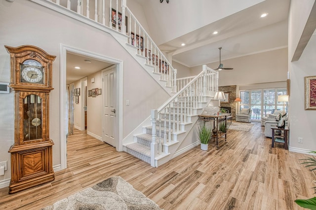 6772 N Wembley Dr, Fresno, CA 93711 - stairs featuring a towering ceiling, ceiling fan, wood finished floors, baseboards, and recessed lighting