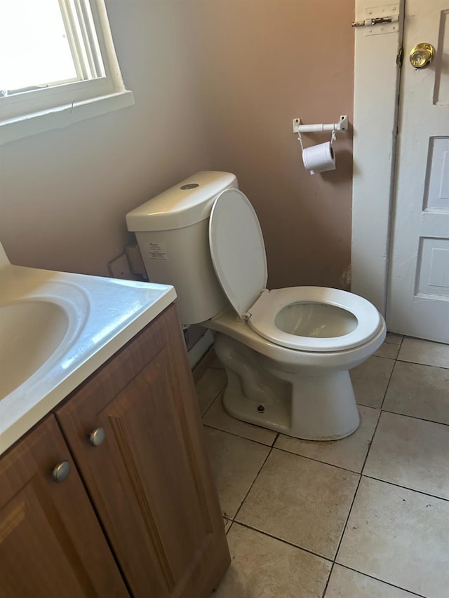 2121 E Hammond Ave, Fresno, CA 93703 - half bath featuring vanity and tile patterned floors