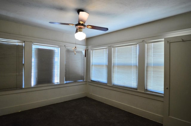 1605 N Arthur Ave, Fresno, CA 93705 - empty room with dark colored carpet and a ceiling fan