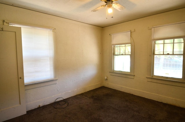 1605 N Arthur Ave, Fresno, CA 93705 - empty room with dark carpet and a ceiling fan
