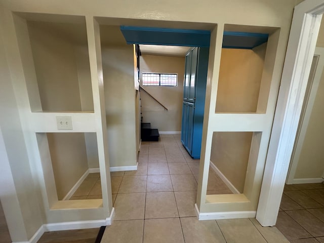 3023 E White Ave, Fresno, CA 93701 - hall featuring light tile patterned floors and baseboards