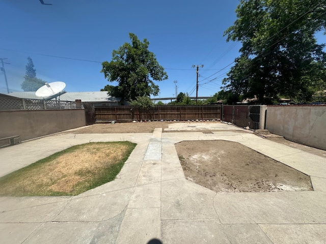 3023 E White Ave, Fresno, CA 93701 - fenced backyard featuring a patio
