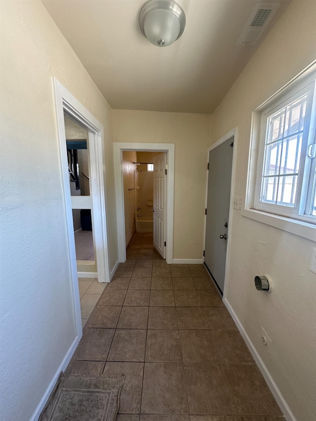 3023 E White Ave, Fresno, CA 93701 - corridor featuring tile patterned flooring and baseboards