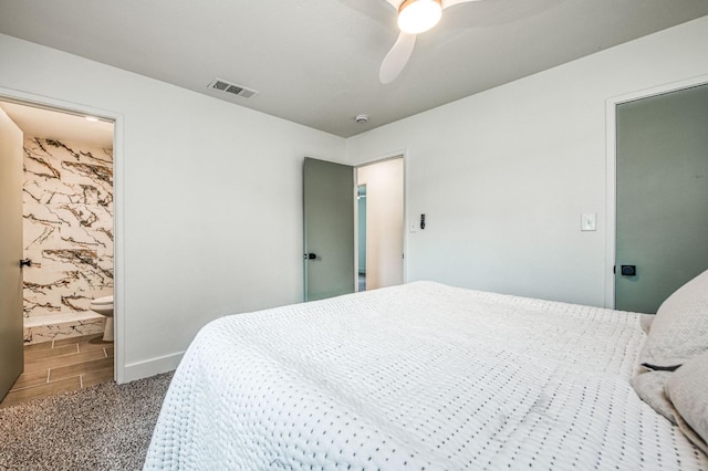 17367 Camden Dr, Madera, CA 93638 - carpeted bedroom with baseboards, a ceiling fan, ensuite bathroom, and wood finished floors