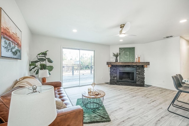 17367 Camden Dr, Madera, CA 93638 - living room featuring wood finished floors, a fireplace, ceiling fan, recessed lighting, and baseboards