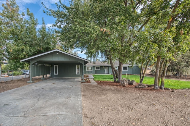 17367 Camden Dr, Madera, CA 93638 - ranch-style house featuring concrete driveway, board and batten siding, and a carport